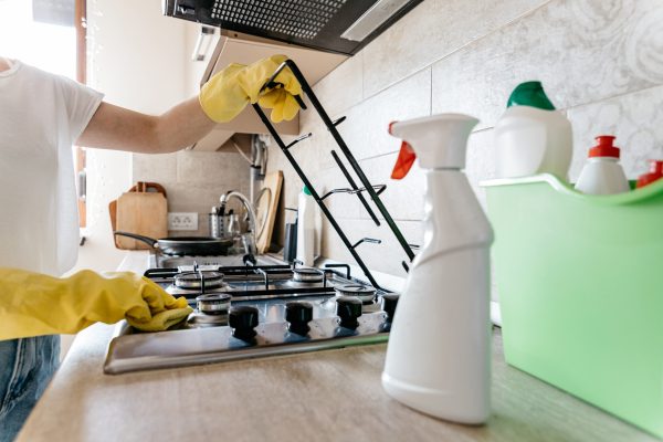 woman-cleaning-the-kitchen-of-her-apartment-2025-01-15-14-37-15-utc